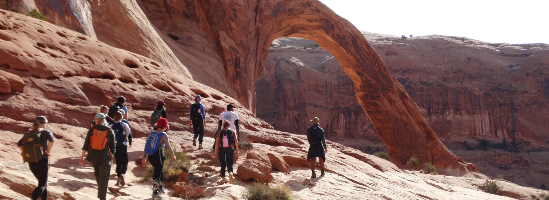 Students exploring the arches in Moab